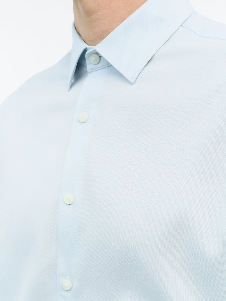 Detail of TIGER OF SWEDEN square cuffs with pleats and double-button closure in Light Blue from eightywingold