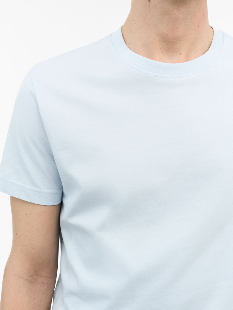 Close-up of TIGER OF SWEDEN ribbed neck trim on Dillan t-shirt in Light Blue from eightywingold
