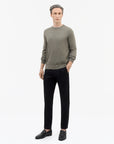 TIGER OF SWEDEN side view of Connor hip-length crew-neck sweater in Dark Grey from eightywingold