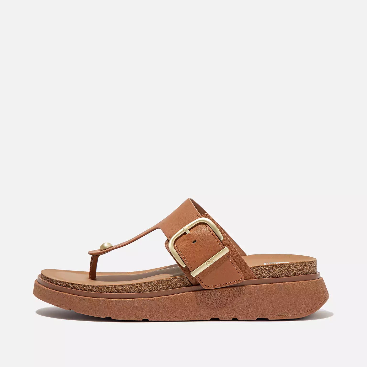 Women's ergonomic T-bar sandals HE7 592 Light Tan, with soft leather straps, chunky cork-edge sole, brushed-metal buckle, and Microwobbleboard™ cushioning for all-day comfort.