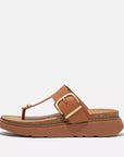 Women's ergonomic T-bar sandals HE7 592 Light Tan, with soft leather straps, chunky cork-edge sole, brushed-metal buckle, and Microwobbleboard™ cushioning for all-day comfort.