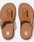 Light Tan FitFlop HE7 592 sandals featuring luxe leather T-bar design, wide fit, recycled metal accents, and APMA-approved comfort technology.