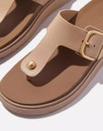 HE7 Fitflop – luxe leather T-bar sandals with domed stud, wide fit, cushioned Microwobbleboard™ sole, and brushed-metal buckle for adjustable comfort.
