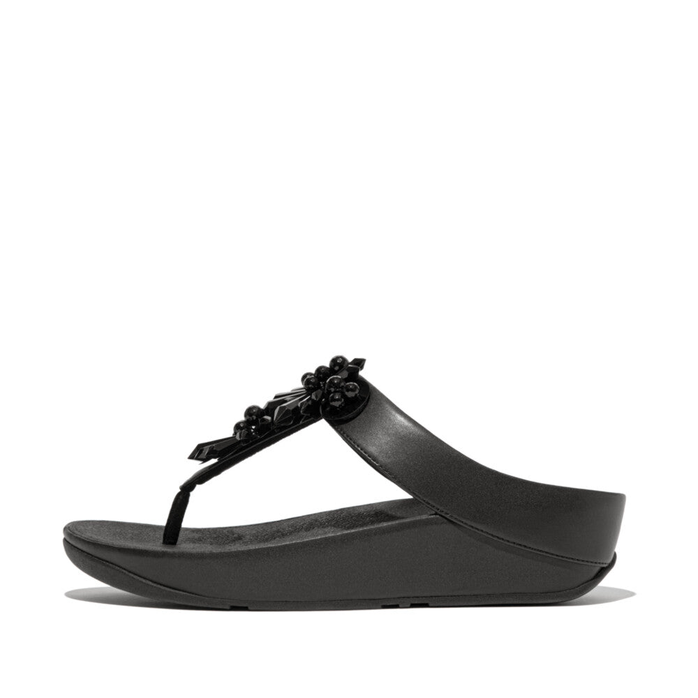 FitFlop IE6 001 Black women's sandals with starburst crystal embellishments, faux-leather upper, and Microwobbleboard™ cushioning – available in Canada.