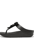 FitFlop IE6 001 Black women's sandals with starburst crystal embellishments, faux-leather upper, and Microwobbleboard™ cushioning – available in Canada.