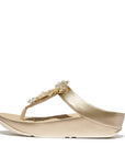 FitFlop IG9 675 Platino women’s sandals with metallic faux-leather straps, clear crystal starburst accents, and Microwobbleboard™ cushioning – Canada-ready style.