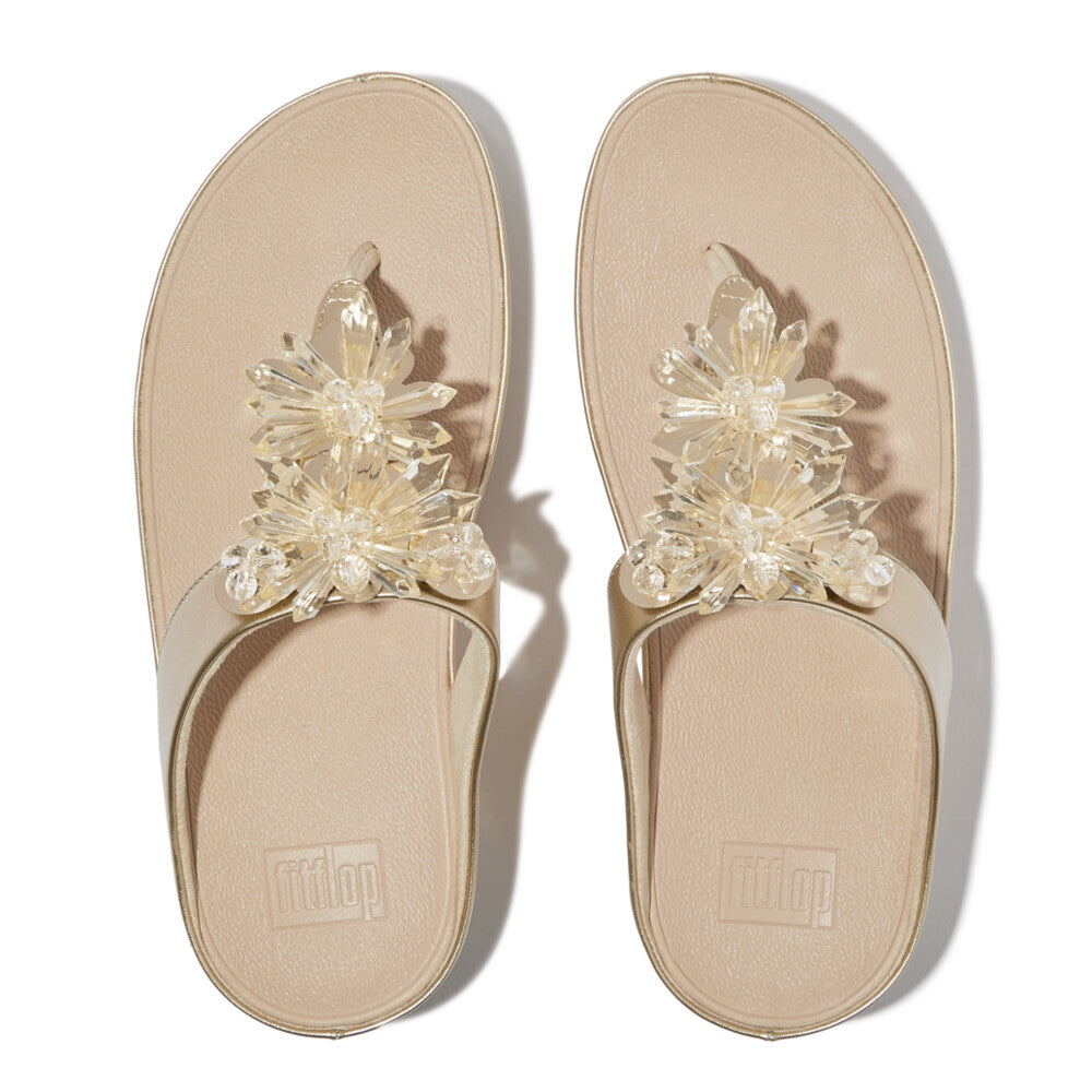 IG9 675 Platino FitFlop sandals for women featuring shimmering gold-tone finish, chandelier-style crystals, and ergonomic support for all-day comfort.