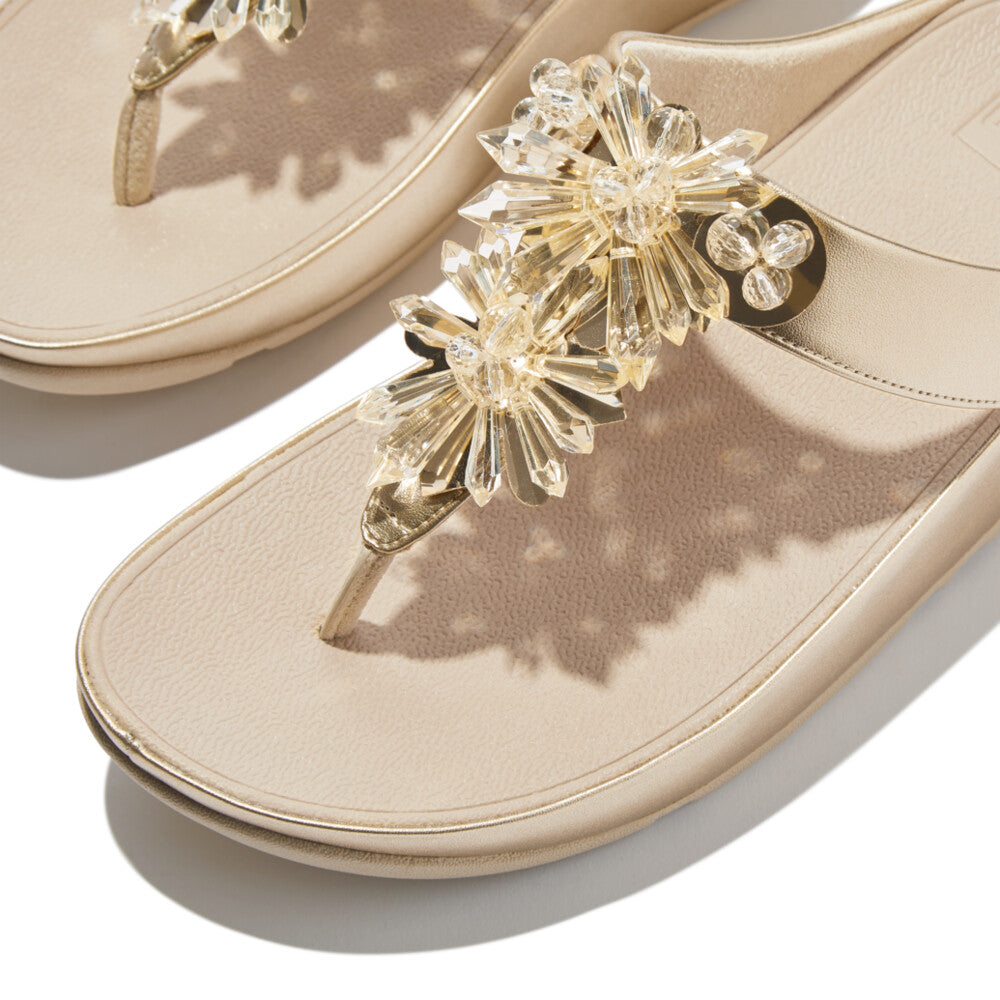 Platino FitFlop IG9 675 sandals with sparkling faceted crystals, triple-density Microwobbleboard™ midsole, and soft microfibre toe post – available in Canada.