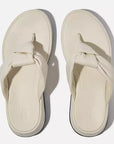 Top-down image of Paris Beige FITFLOP slip-on sandals in Canada with twist-detail strap and APMA-certified sup