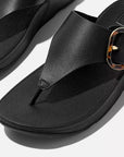 Black FITFLOP Lulu leather sandals in Canada with statement tortoiseshell buckle and ergonomic design