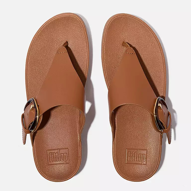 Top-down image of Deep Tan FITFLOP Lulu slip-on sandals in Canada with padded uppers and toe-post design