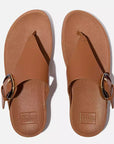 Top-down image of Deep Tan FITFLOP Lulu slip-on sandals in Canada with padded uppers and toe-post design