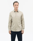 TIGER OF SWEDEN side view of curved hem Spenser shirt in Vintage Beige from eightywingold