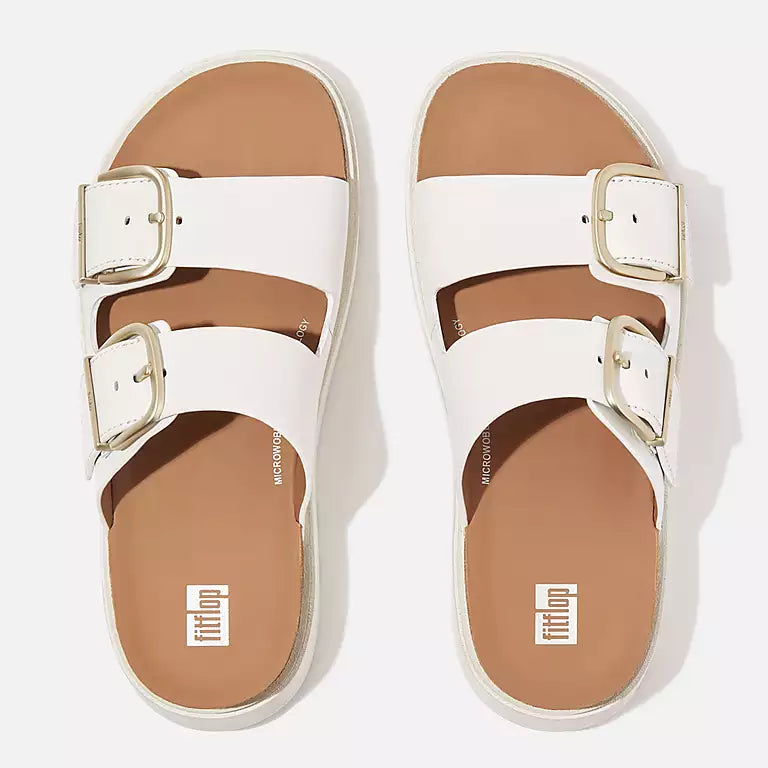 

Top view of Urban White FITFLOP sandals in Canada featuring clean minimalist design and ergonomic cork-infused sole