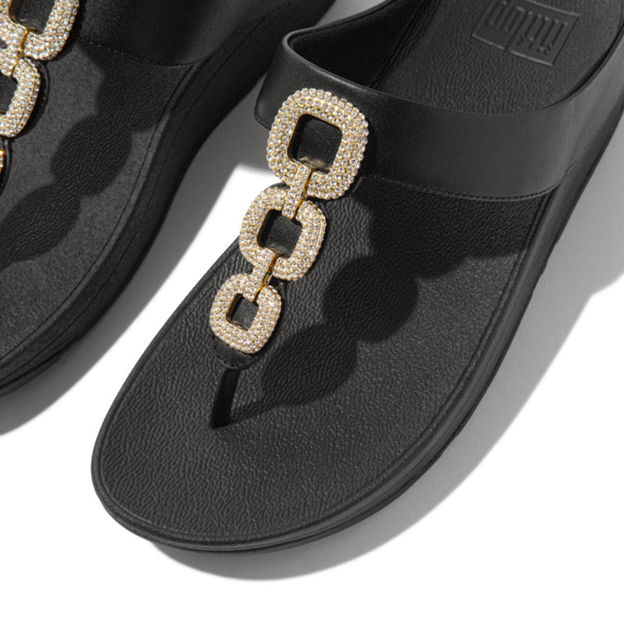 Elegant FitFlop HX2 001 Black sandals with soft toe-post leather, recycled zinc chain design, triple-density midsole, and natural arch support.
