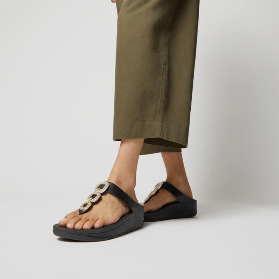 FitFlop HX2 001 Black ergonomic women’s sandals with soft leather, crystal chain detail, and Microwobbleboard™ cushioning – available in Canada.
