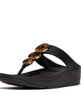 IBO 001 All Black FitFlop women’s sandals with all-black marbled resin hoops, triple-density sole, and recycled zinc hardware – made for everyday wear.