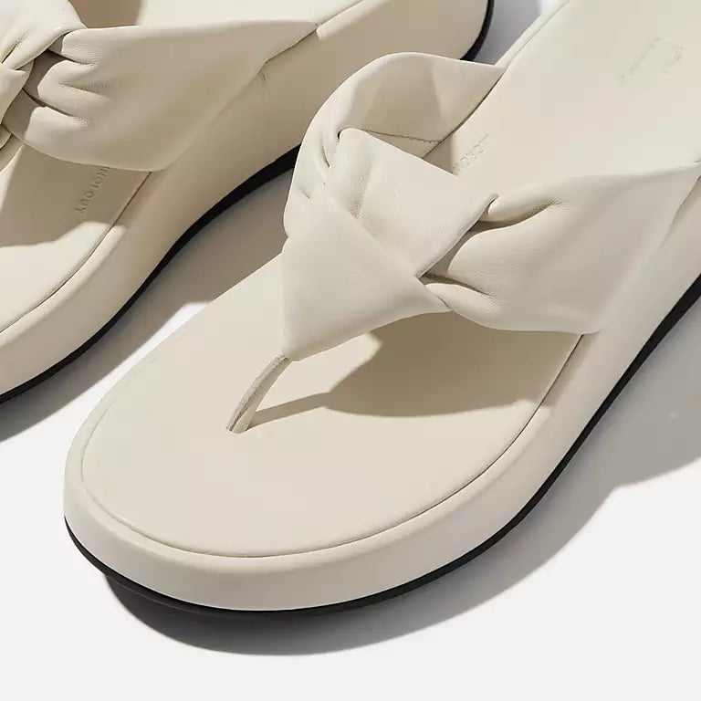 Side view of Paris Beige FITFLOP sandals in Canada featuring padded leather strap and ergonomic cushioning