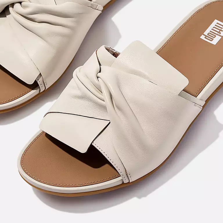 Elegant FITFLOP slides in Canada in Paris Beige featuring sculptural leather bow and ergonomic support