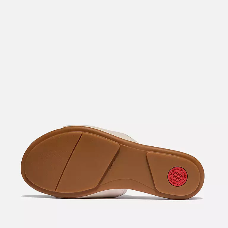 Sole view of FITFLOP Paris Beige slides in Canada with pressure-diffusing footbed and faux-leather-wrapped sole