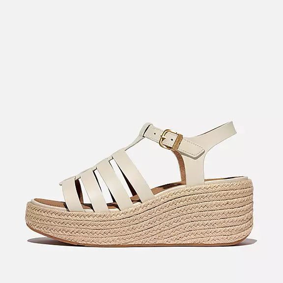 Side view of Paris Beige FITFLOP sandals in Canada with high wedge heel and recycled metal buckle