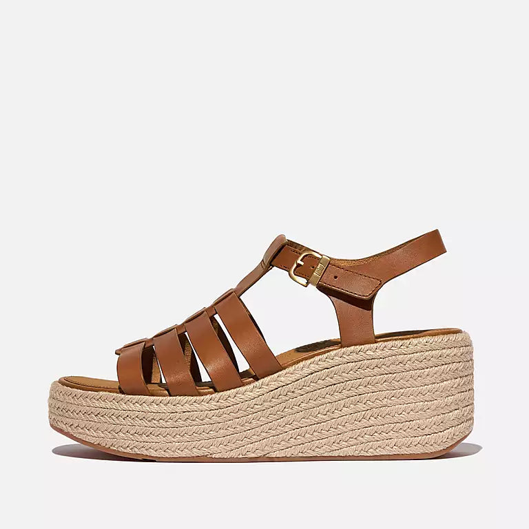 Side view of Deep Tan FITFLOP sandals in Canada with contoured footbed and adjustable metal buckle