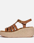 Side view of Deep Tan FITFLOP sandals in Canada with contoured footbed and adjustable metal buckle