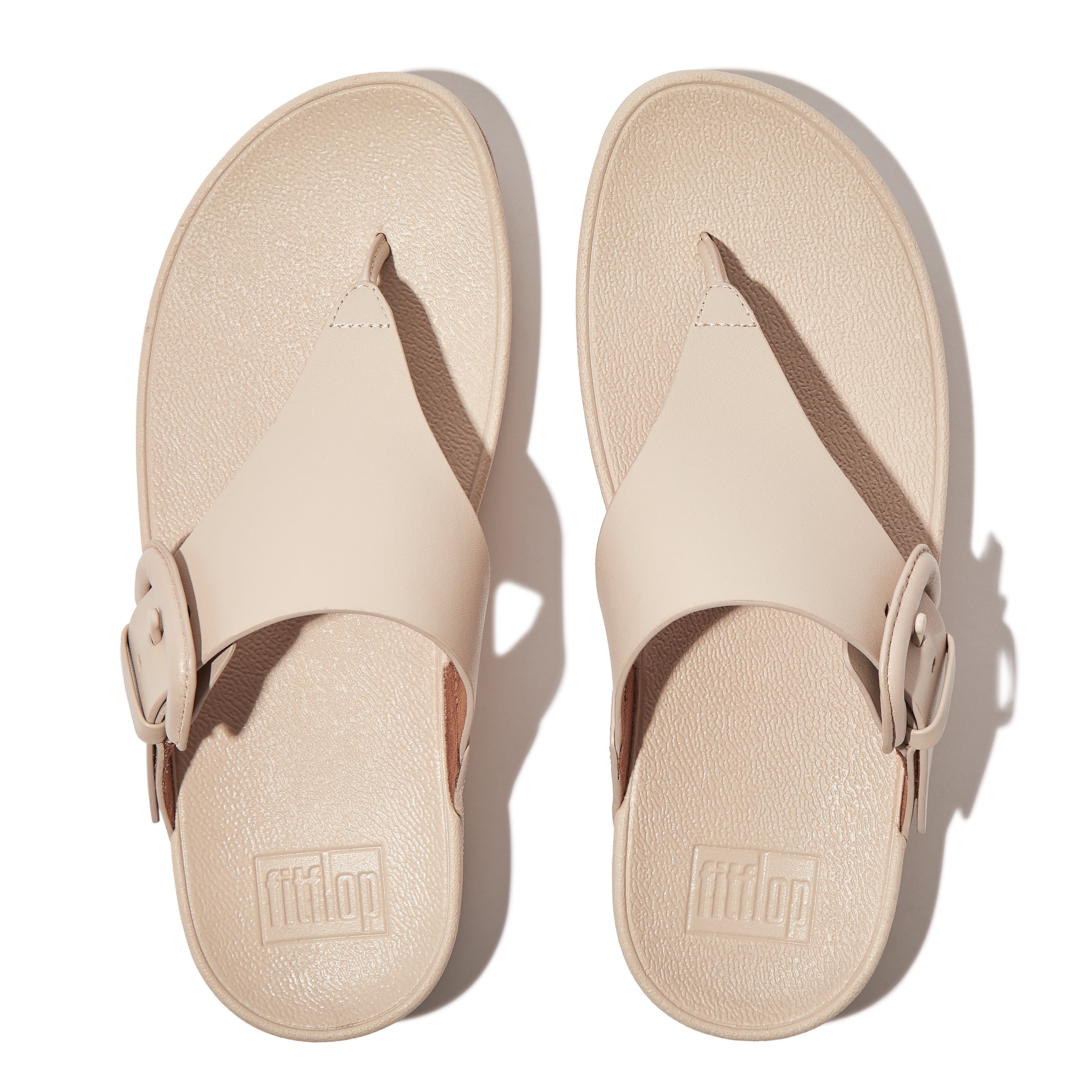 FITFLOP Lulu Covered-Buckle Raw-Edge Leather Toe-Thongs in Beige HG9 | Shop from eightywingold an official brand partner for Fitflop Canada and US.