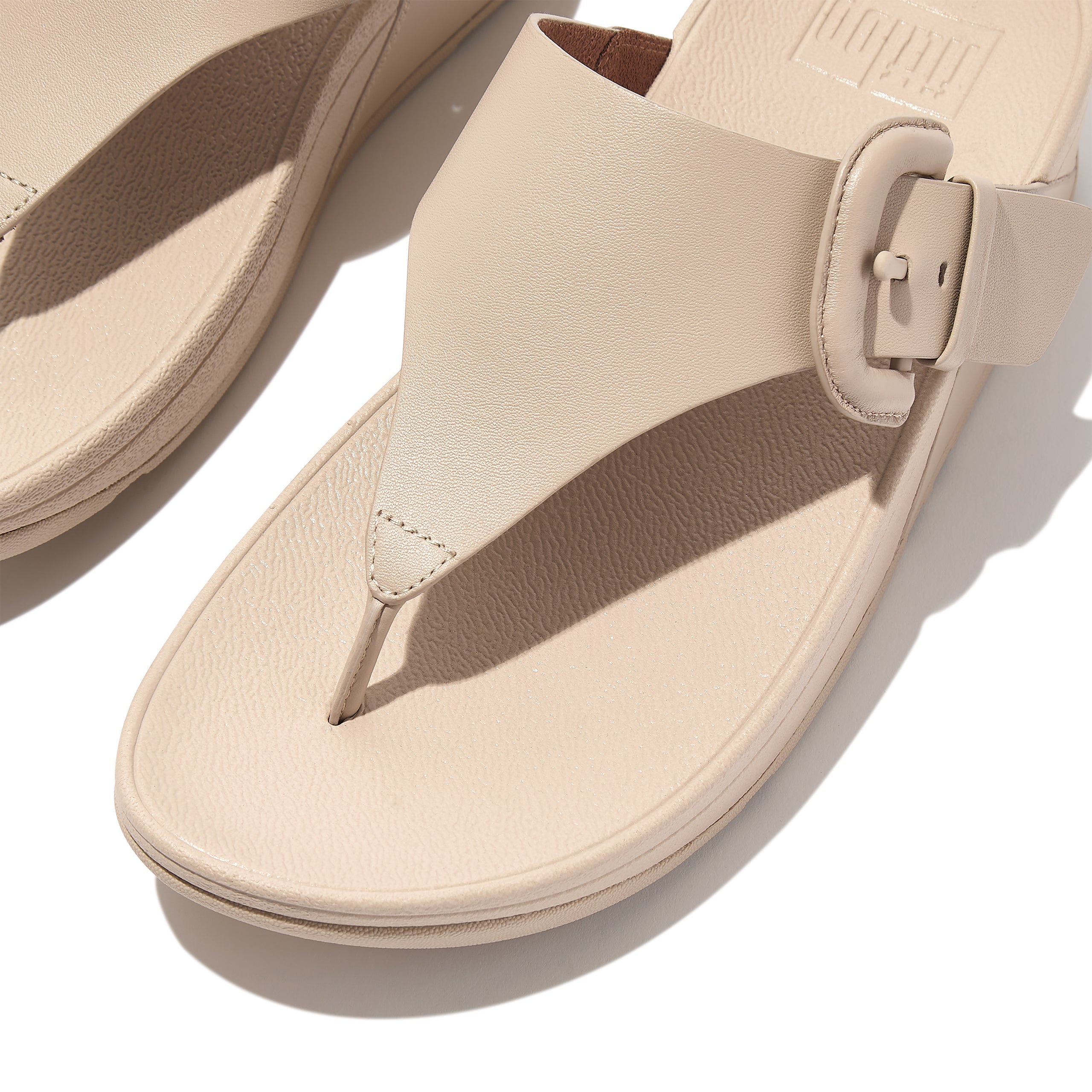 FITFLOP Lulu Covered-Buckle Raw-Edge Leather Toe-Thongs in Beige HG9 | Shop from eightywingold an official brand partner for Fitflop Canada and US.