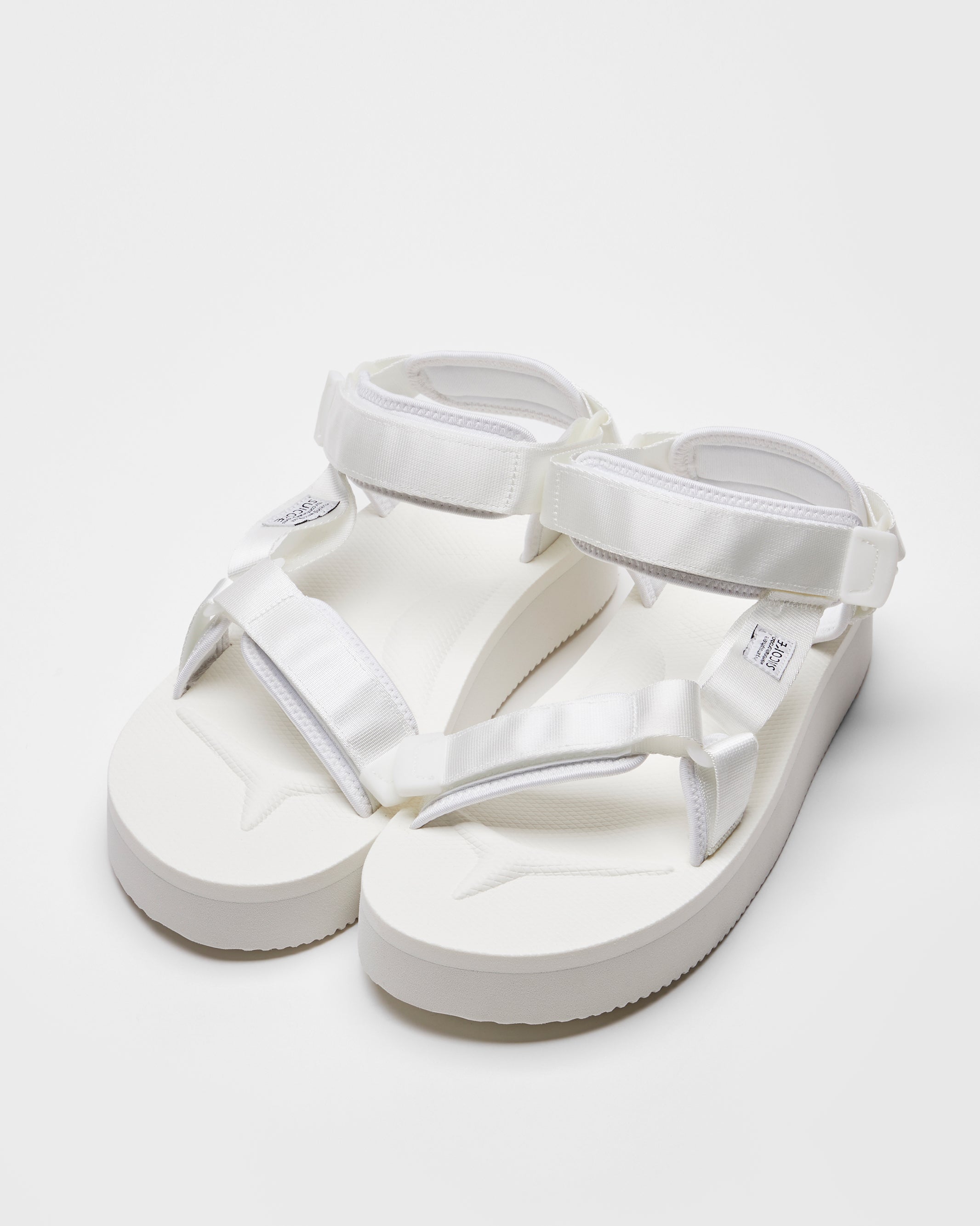 SUICOKE DEPA-2PO sandals with white nylon upper, white midsole and sole, strap and logo patch. From Spring/Summer 2023 collection on SUICOKE Official US & Canada Webstore. OG-022-2PO WHITE