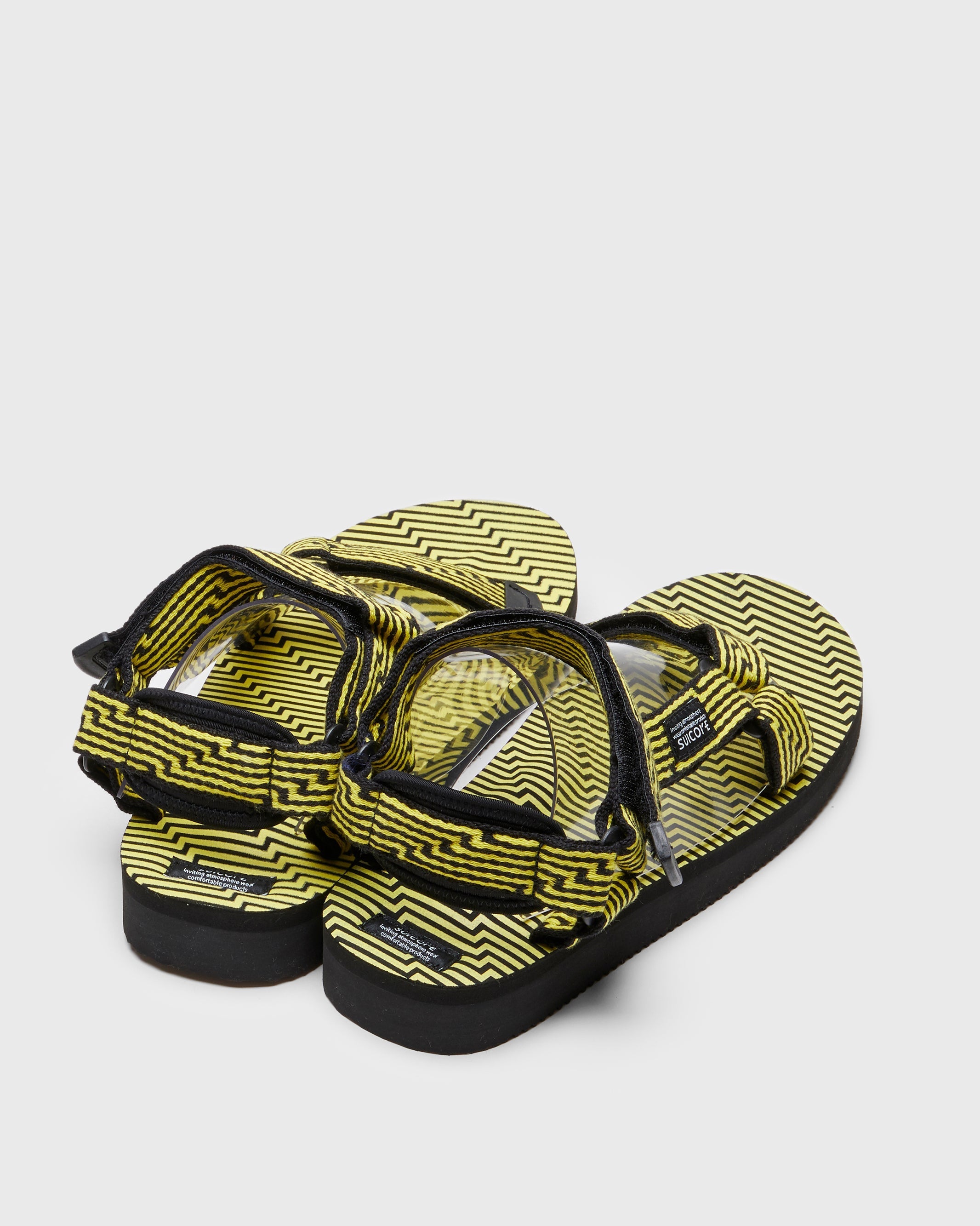 SUICOKE DEPA-JC01 sandals with black & yellow nylon upper, black & yellow midsole and sole, strap and logo patch. From Spring/Summer 2023 collection on SUICOKE Official US & Canada Webstore. OG-022-JC01 BLACK X YELLOW