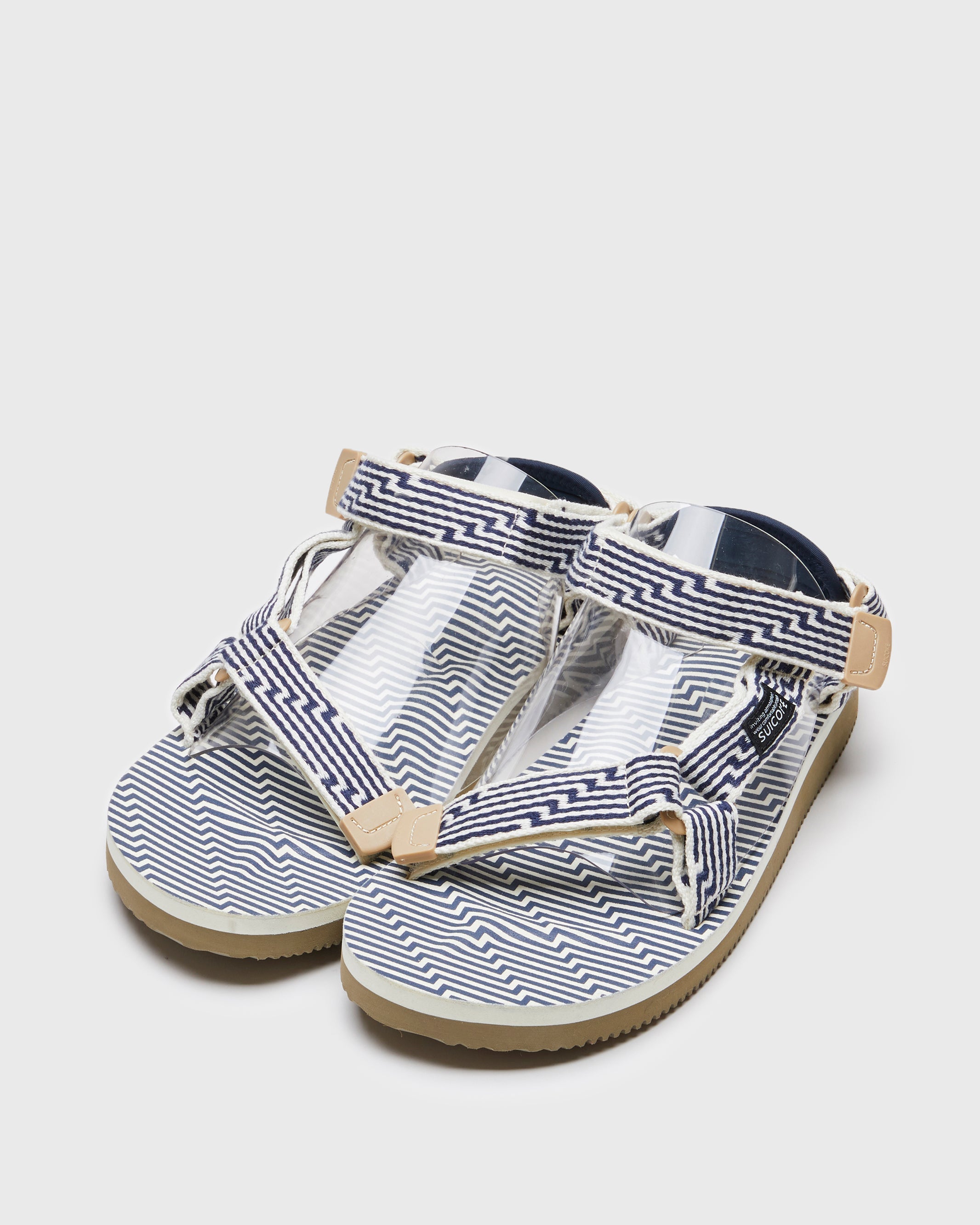 SUICOKE DEPA-JC01 sandals with ivory & navy nylon upper, ivory & navy midsole and sole, strap and logo patch. From Spring/Summer 2023 collection on SUICOKE Official US & Canada Webstore. OG-022-JC01 IVORY X NAVY