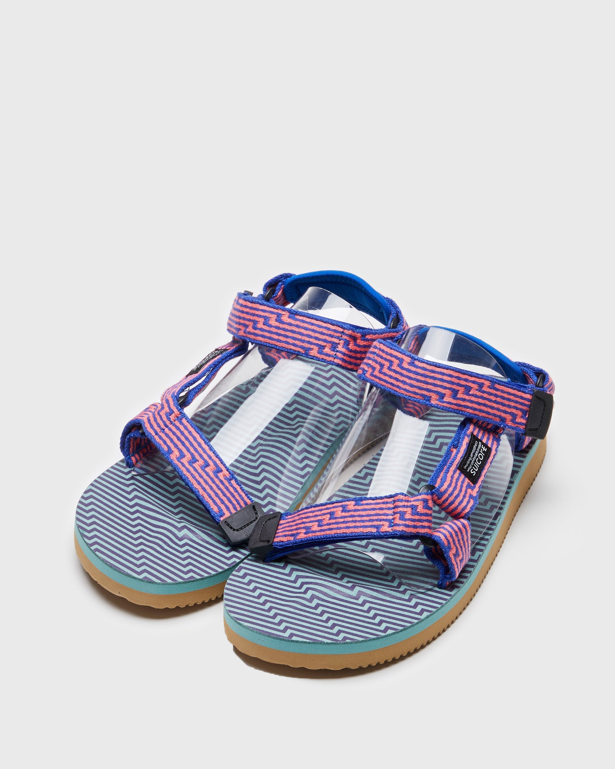 SUICOKE DEPA-JC01 sandals with orange & blue nylon upper, orange & blue midsole and sole, strap and logo patch. From Spring/Summer 2023 collection on SUICOKE Official US & Canada Webstore. OG-022-JC01 ORANGE X BLUE