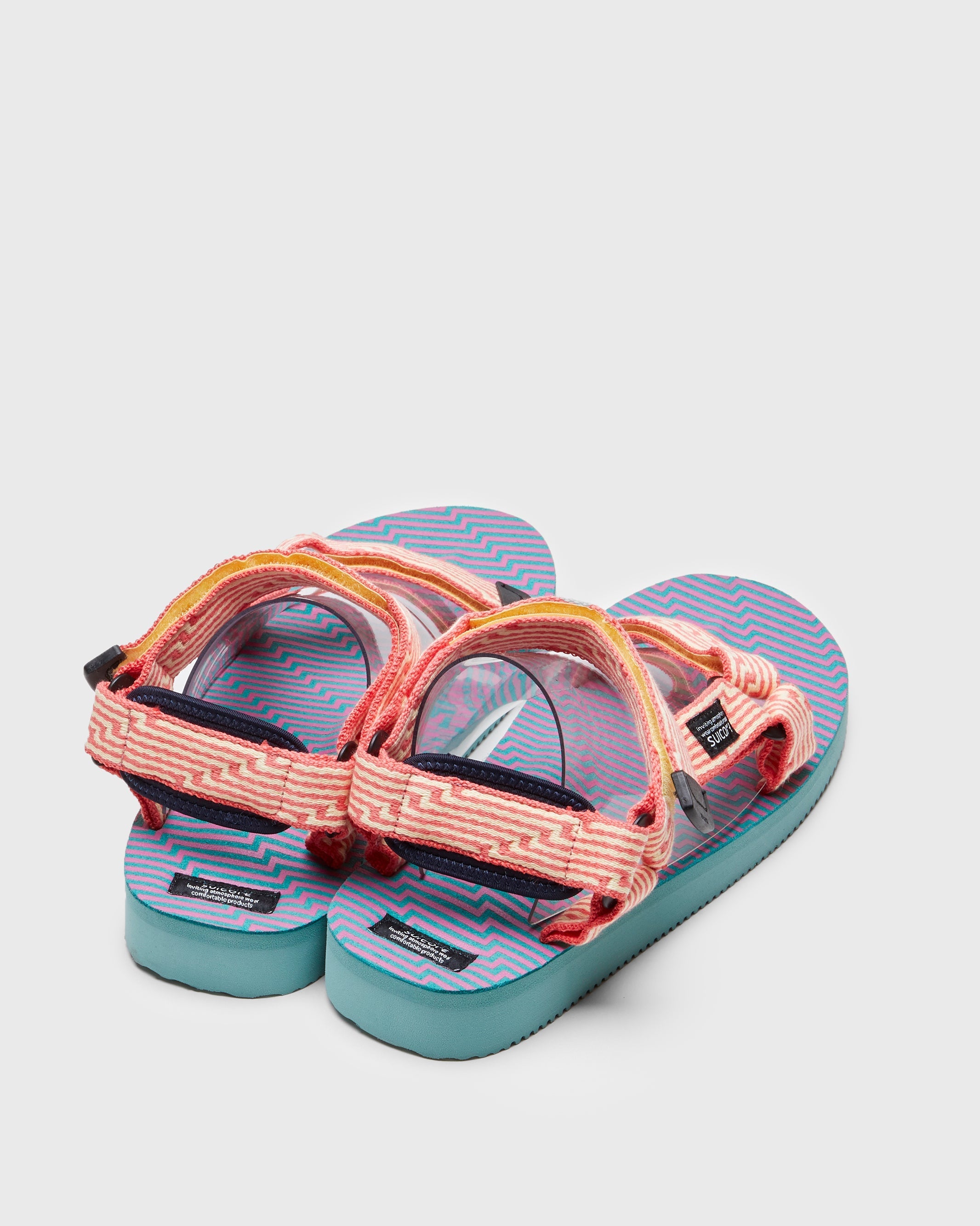 SUICOKE DEPA-JC01 sandals with yellow & pink nylon upper, yellow & pink midsole and sole, strap and logo patch. From Spring/Summer 2023 collection on SUICOKE Official US & Canada Webstore. OG-022-JC01 YELLOW X PINK