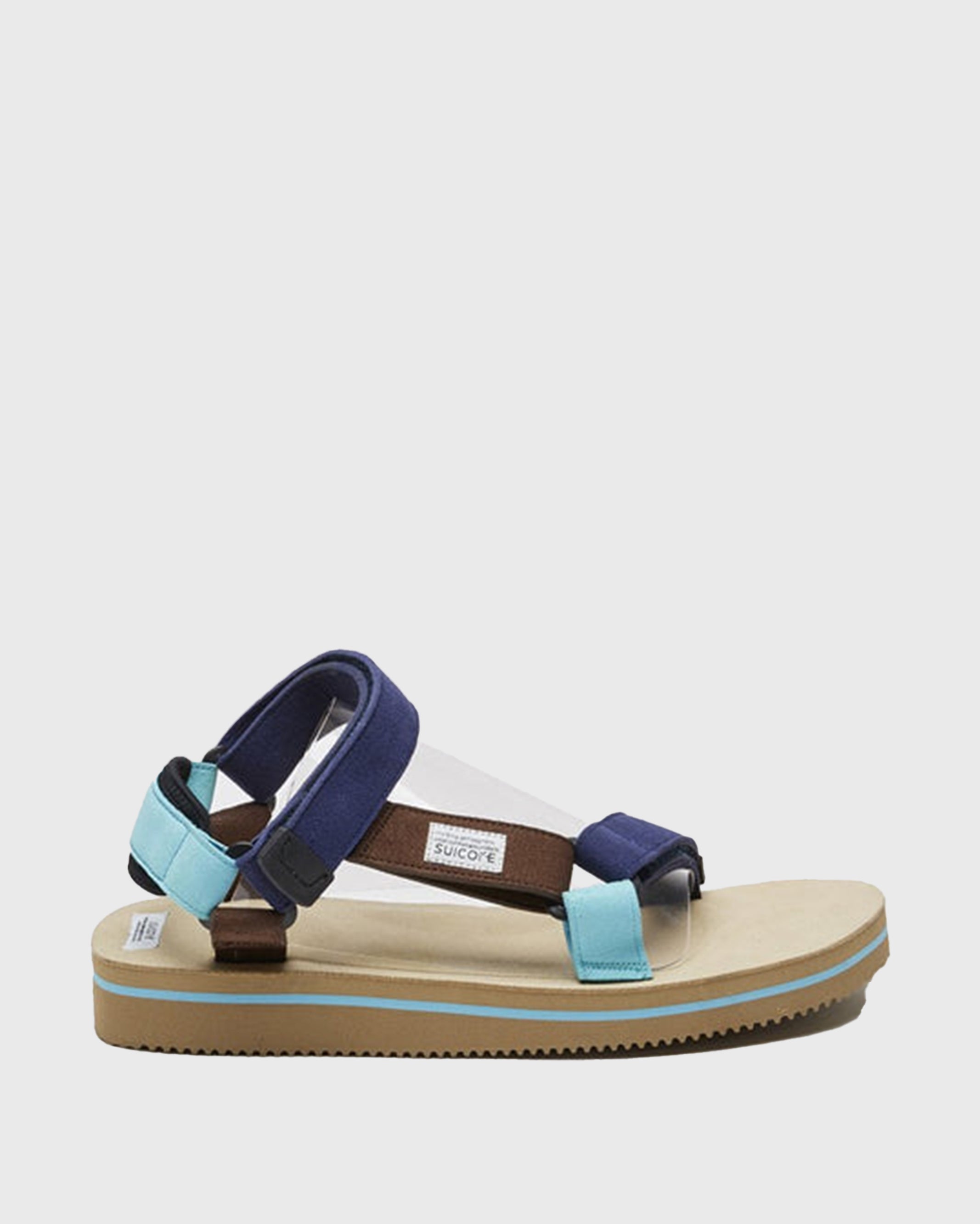 SUICOKE DEPA-ECS sandals with blue artificial leather upper, beige midsole and sole, straps and logo patch. From Spring/Summer 2022 collection on SUICOKE Official US & Canada Webstore.