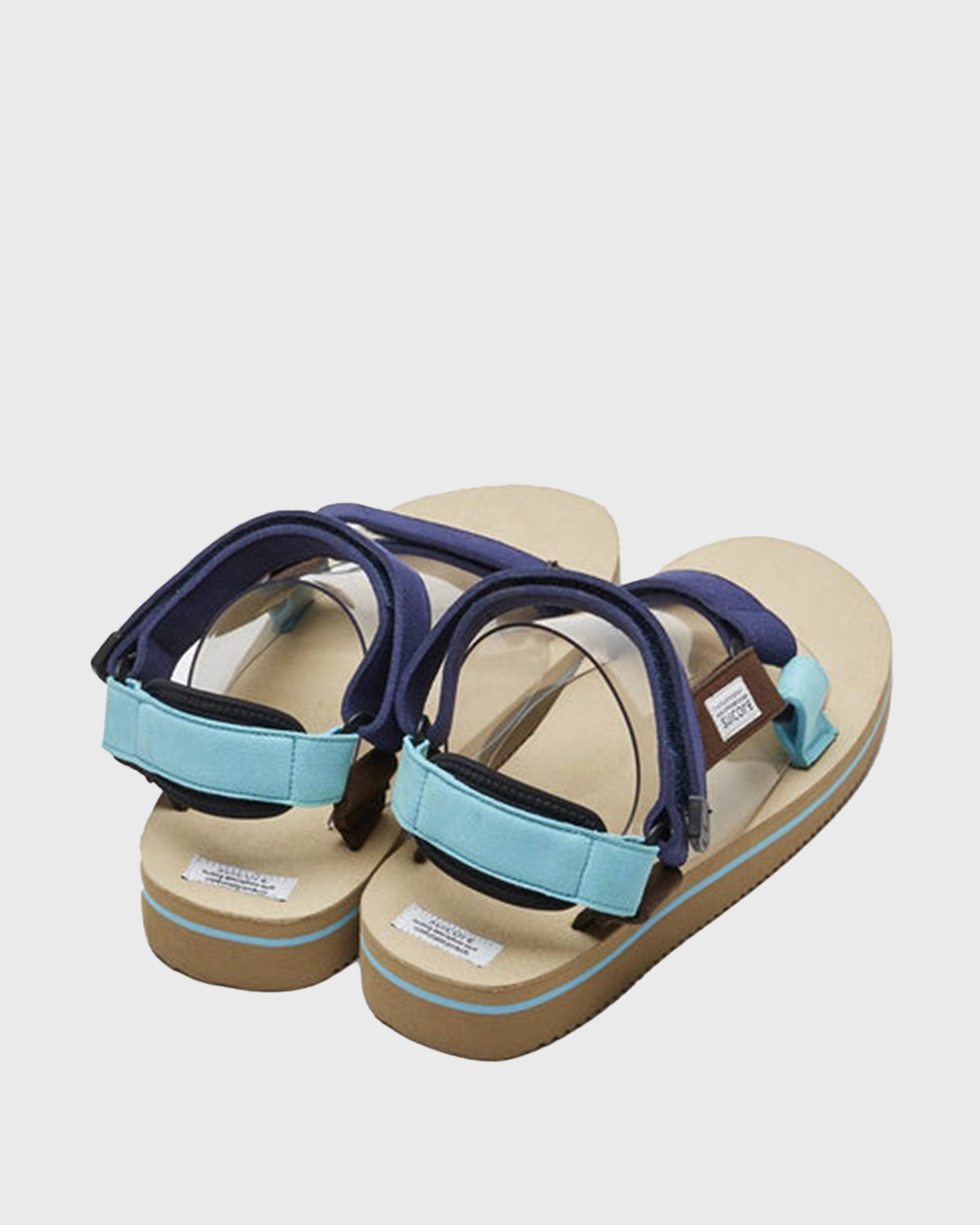 SUICOKE DEPA-ECS sandals with blue artificial leather upper, beige midsole and sole, straps and logo patch. From Spring/Summer 2022 collection on SUICOKE Official US & Canada Webstore.