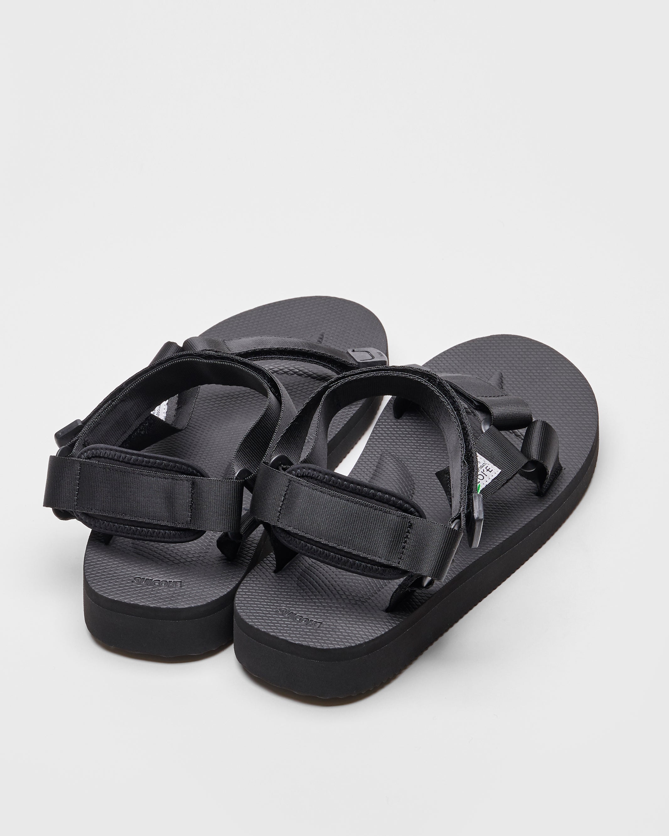 SUICOKE DEPA-Cab sandals with black nylon upper, black midsole and sole, strap and logo patch. From Spring/Summer 2022 collection on SUICOKE Official US & Canada Webstore.