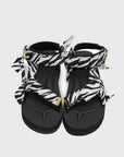 SUICOKE Depa-Fbcpocab-A black platform sandal with zebra printed straps + gold hardware logo tips. From SUICOKE SS21 collection.