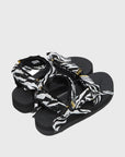 SUICOKE Depa-Fbcpocab-A black platform sandal with zebra printed straps + gold hardware logo tips. From SUICOKE SS21 collection.