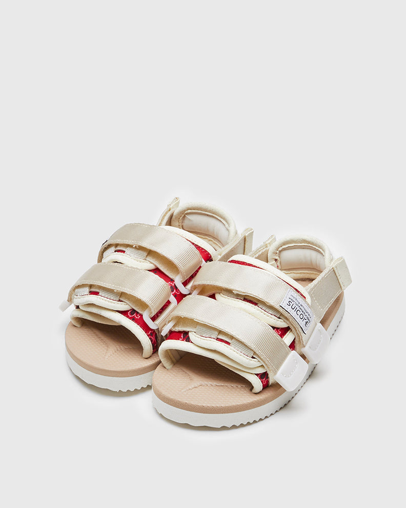 SUICOKE MOTO-2kids-PT05 slides with red & beige nylon upper, red & beige midsole and sole, strap and logo patch. From Spring/Summer 2023 collection on SUICOKE Official US & Canada Webstore. OG-056-2KIDS-PT05 RED X BEIGE