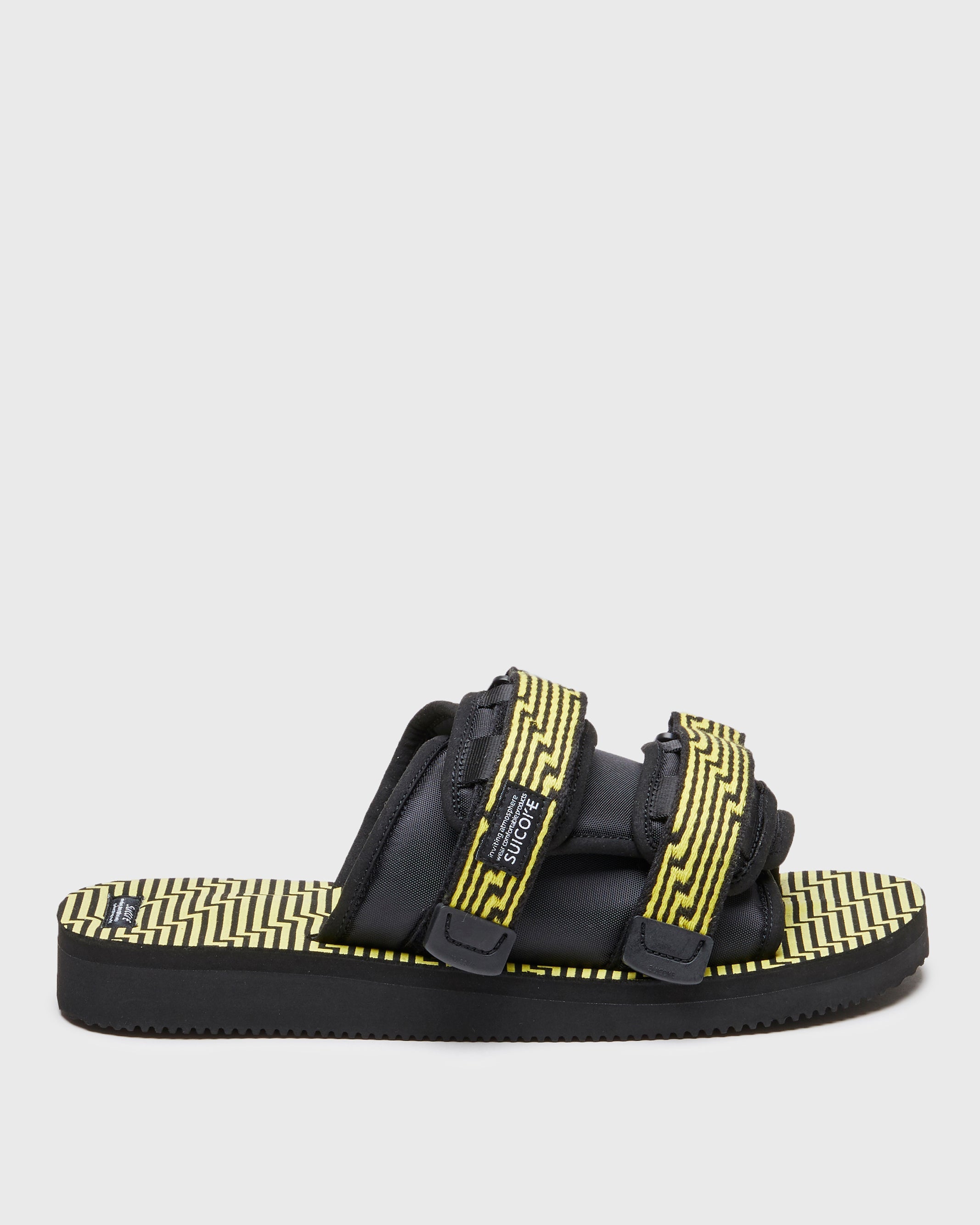 SUICOKE MOTO-JC01 slides with black & yellow nylon and synthetic material  upper, black & yellow midsole and sole, straps and logo patch. From Spring/Summer 2023 collection on SUICOKE Official US & Canada Webstore. OG-056-JC01 BLACK X YELLOW