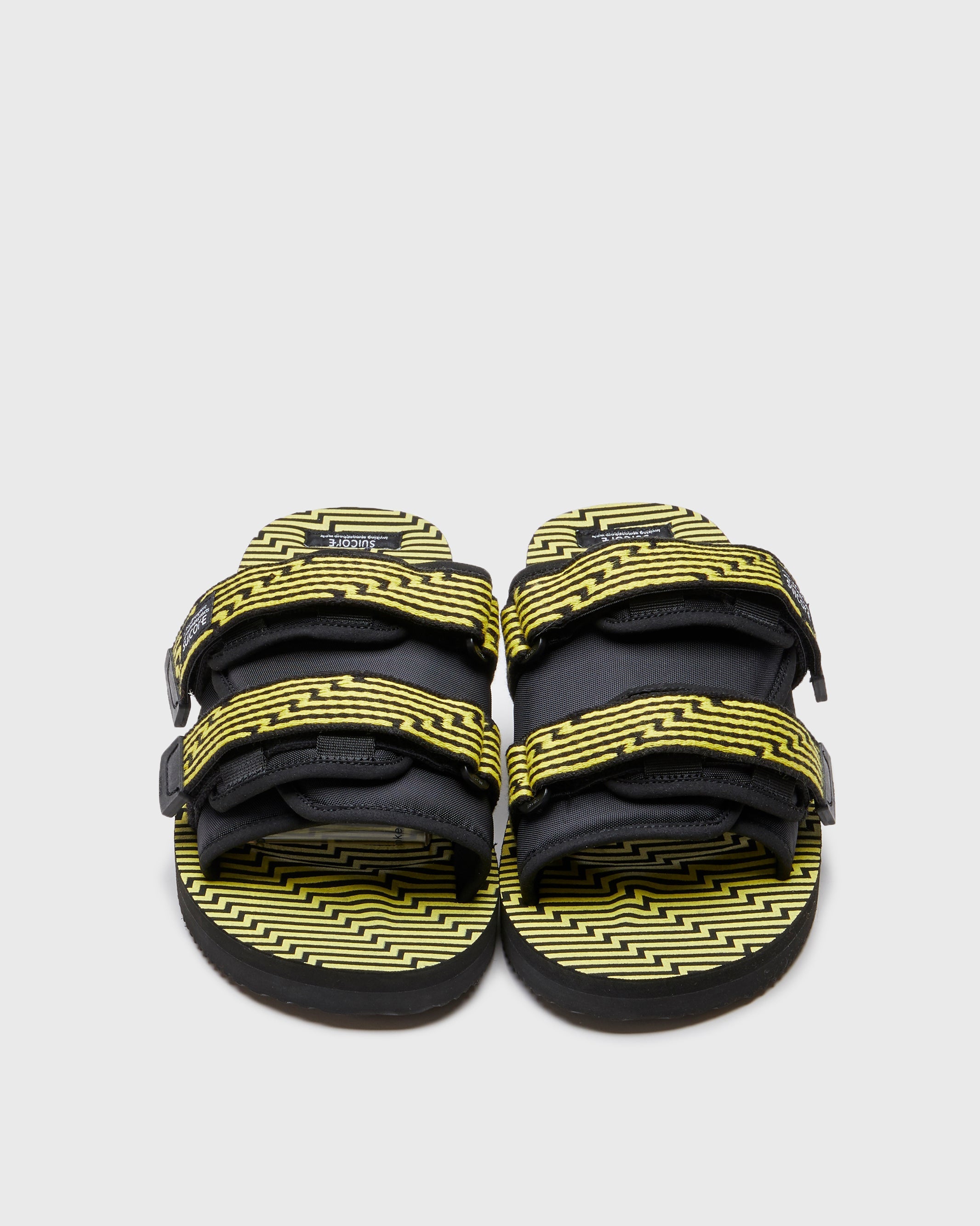 SUICOKE MOTO-JC01 slides with black & yellow nylon and synthetic material  upper, black & yellow midsole and sole, straps and logo patch. From Spring/Summer 2023 collection on SUICOKE Official US & Canada Webstore. OG-056-JC01 BLACK X YELLOW