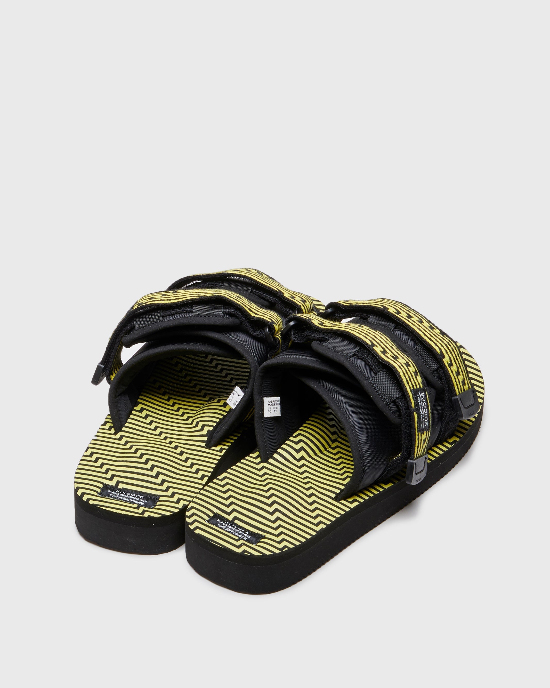 SUICOKE MOTO-JC01 slides with black & yellow nylon and synthetic material  upper, black & yellow midsole and sole, straps and logo patch. From Spring/Summer 2023 collection on SUICOKE Official US & Canada Webstore. OG-056-JC01 BLACK X YELLOW