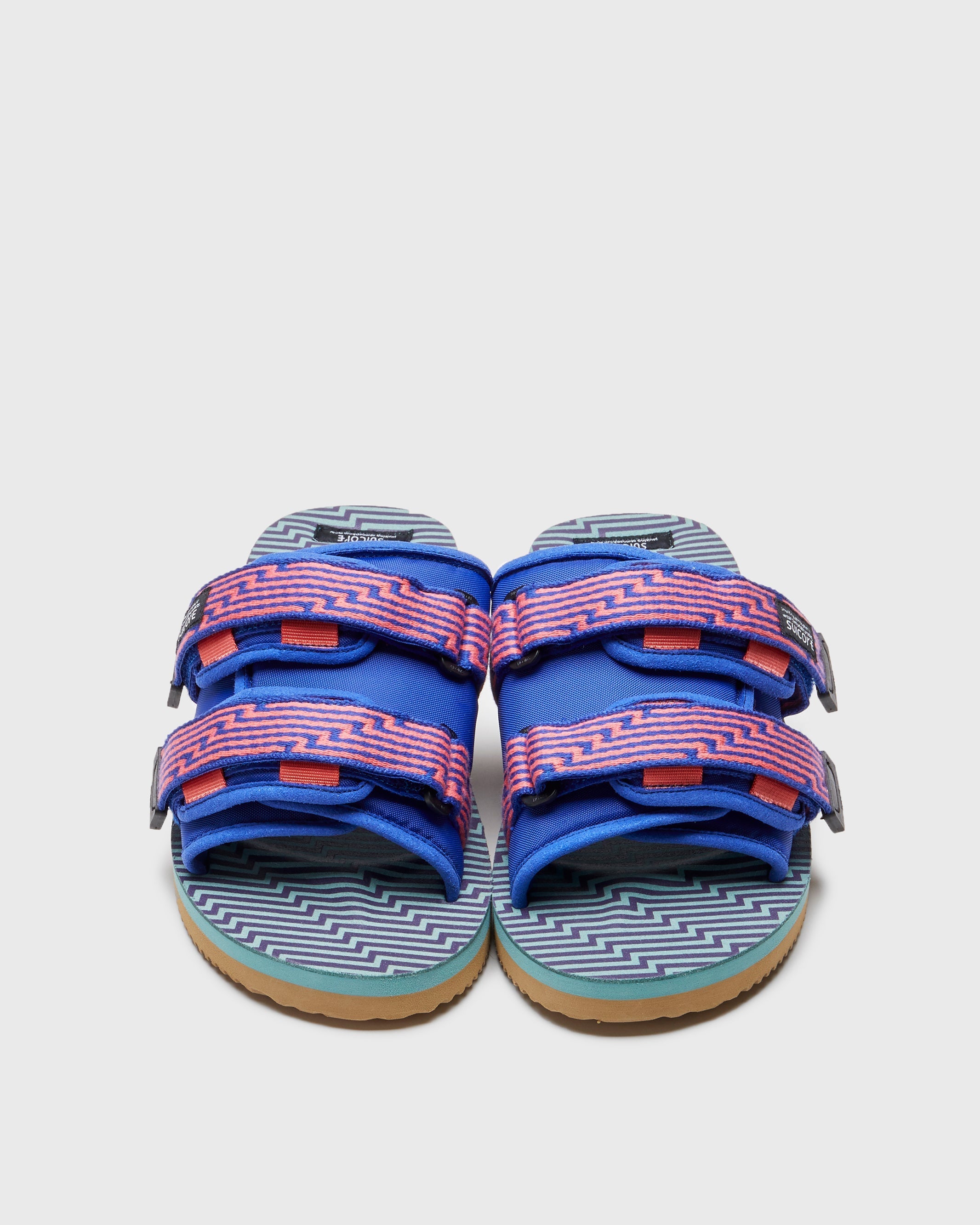 SUICOKE MOTO-JC01 slides with orange & blue nylon upper, orange & blue midsole and sole, strap and logo patch. From Spring/Summer 2023 collection on SUICOKE Official US & Canada Webstore. OG-056-JC01 ORANGE X BLUE