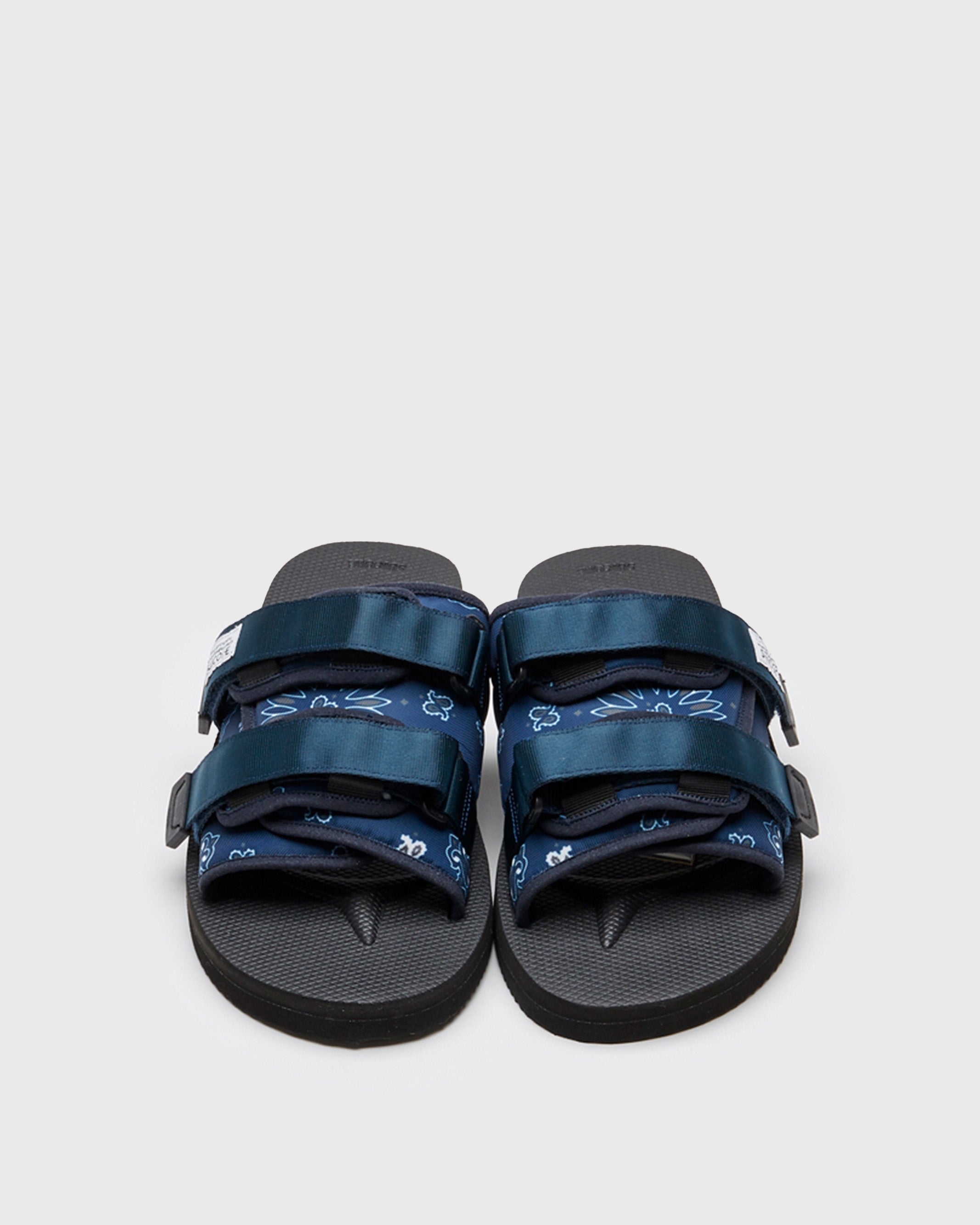 SUICOKE MOTO-Cab-PT02 slides with navy nylon upper, black midsole and sole, straps and logo patch. From Spring/Summer 2022 collection on SUICOKE Official US & Canada Webstore.