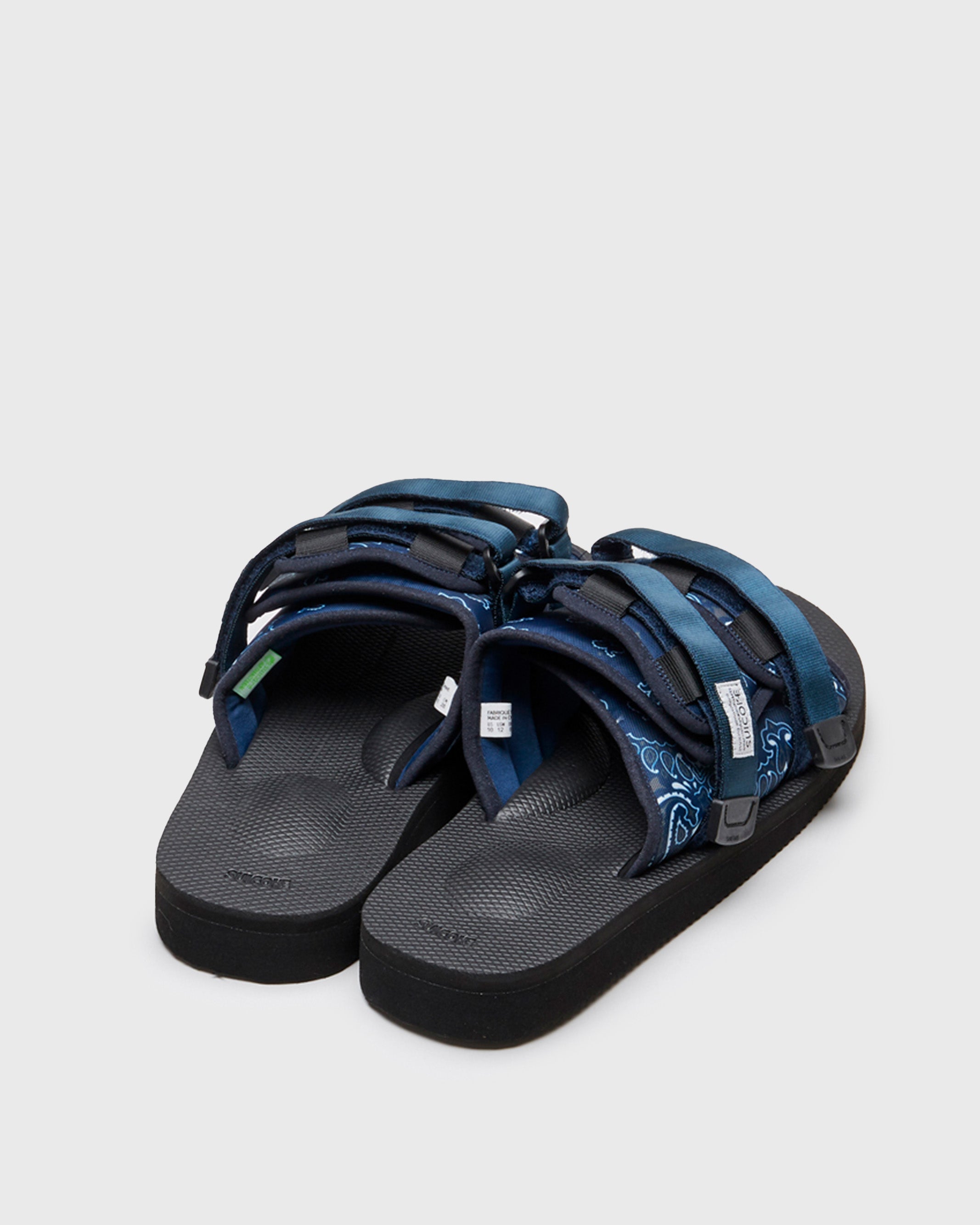 SUICOKE MOTO-Cab-PT02 slides with navy nylon upper, black midsole and sole, straps and logo patch. From Spring/Summer 2022 collection on SUICOKE Official US & Canada Webstore.