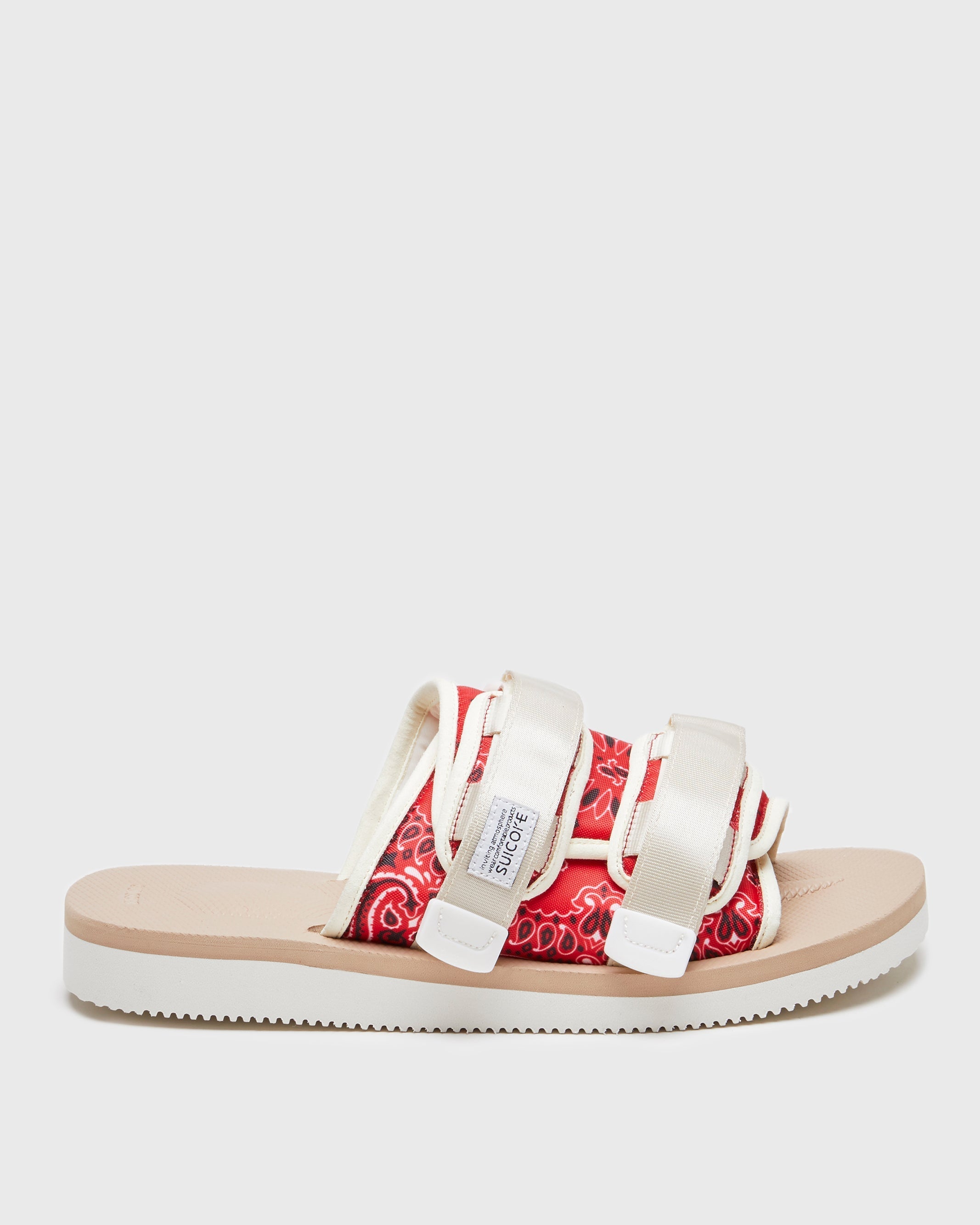 SUICOKE MOTO-Cab-PT05 slides with red & beige nylon upper, red & beige midsole and sole, strap and logo patch. From Spring/Summer 2023 collection on SUICOKE Official US & Canada Webstore. OG-056CAB-PT05 RED X BEIGE