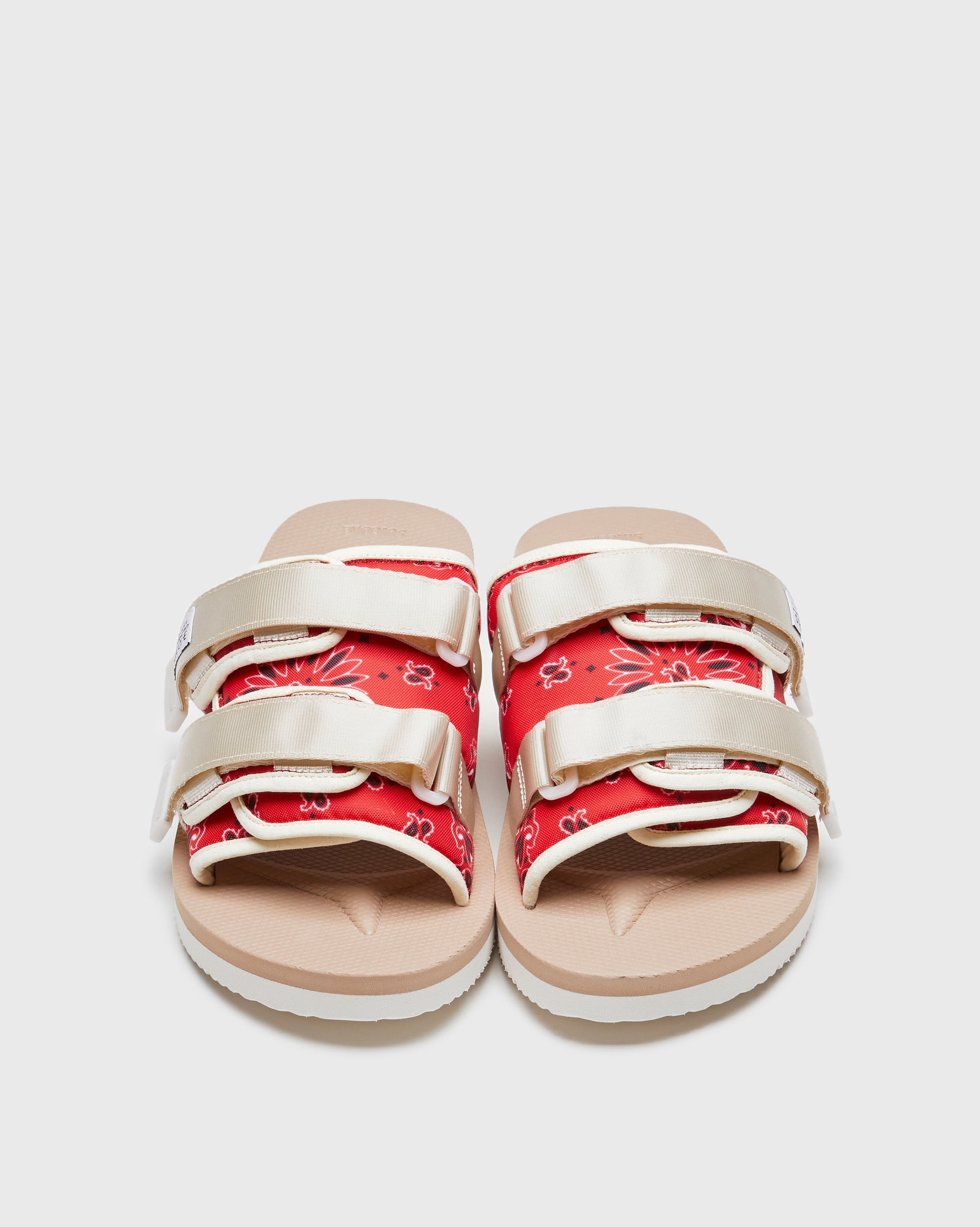 SUICOKE MOTO-Cab-PT05 slides with red & beige nylon upper, red & beige midsole and sole, strap and logo patch. From Spring/Summer 2023 collection on SUICOKE Official US & Canada Webstore. OG-056CAB-PT05 RED X BEIGE