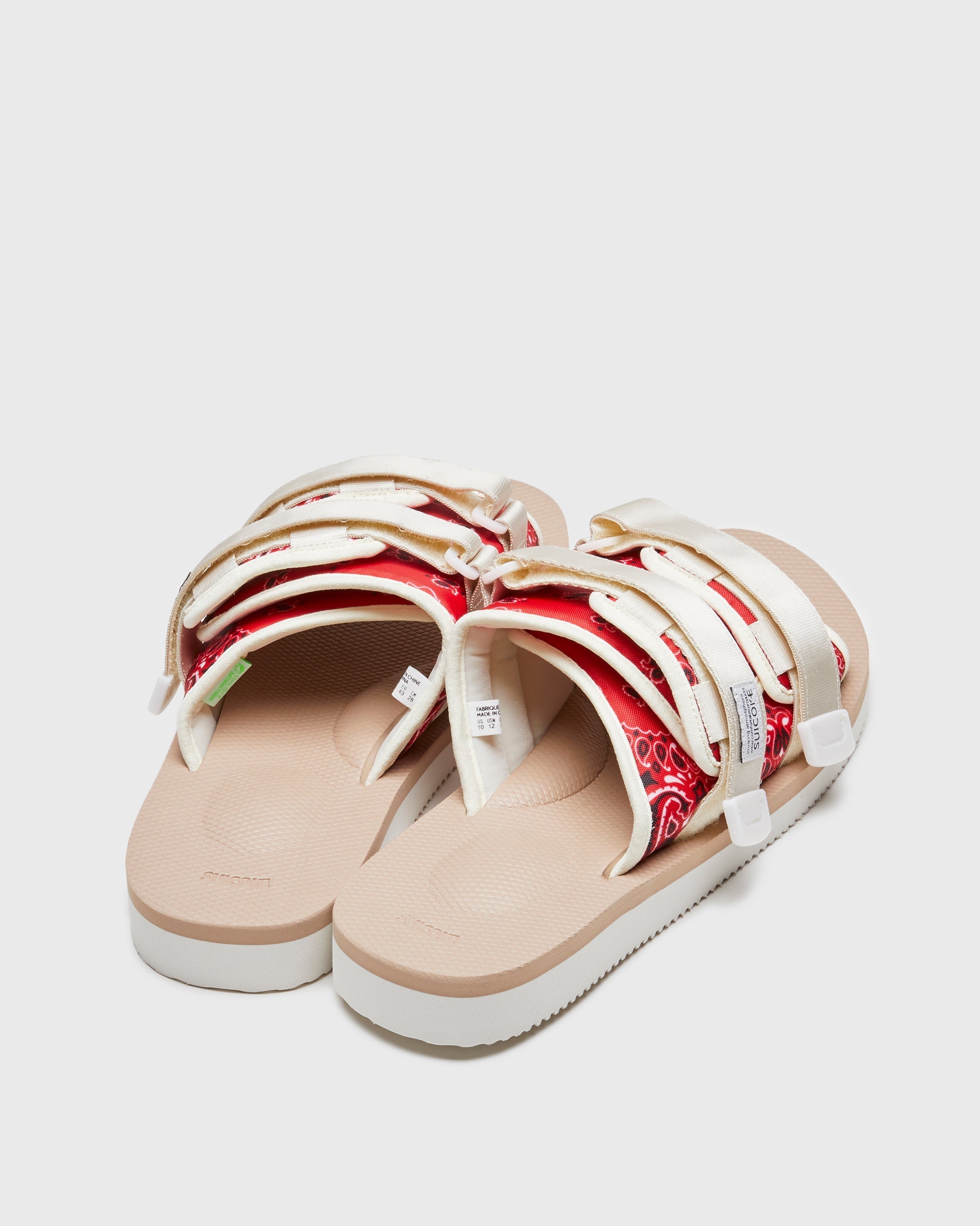 SUICOKE MOTO-Cab-PT05 slides with red & beige nylon upper, red & beige midsole and sole, strap and logo patch. From Spring/Summer 2023 collection on SUICOKE Official US & Canada Webstore. OG-056CAB-PT05 RED X BEIGE