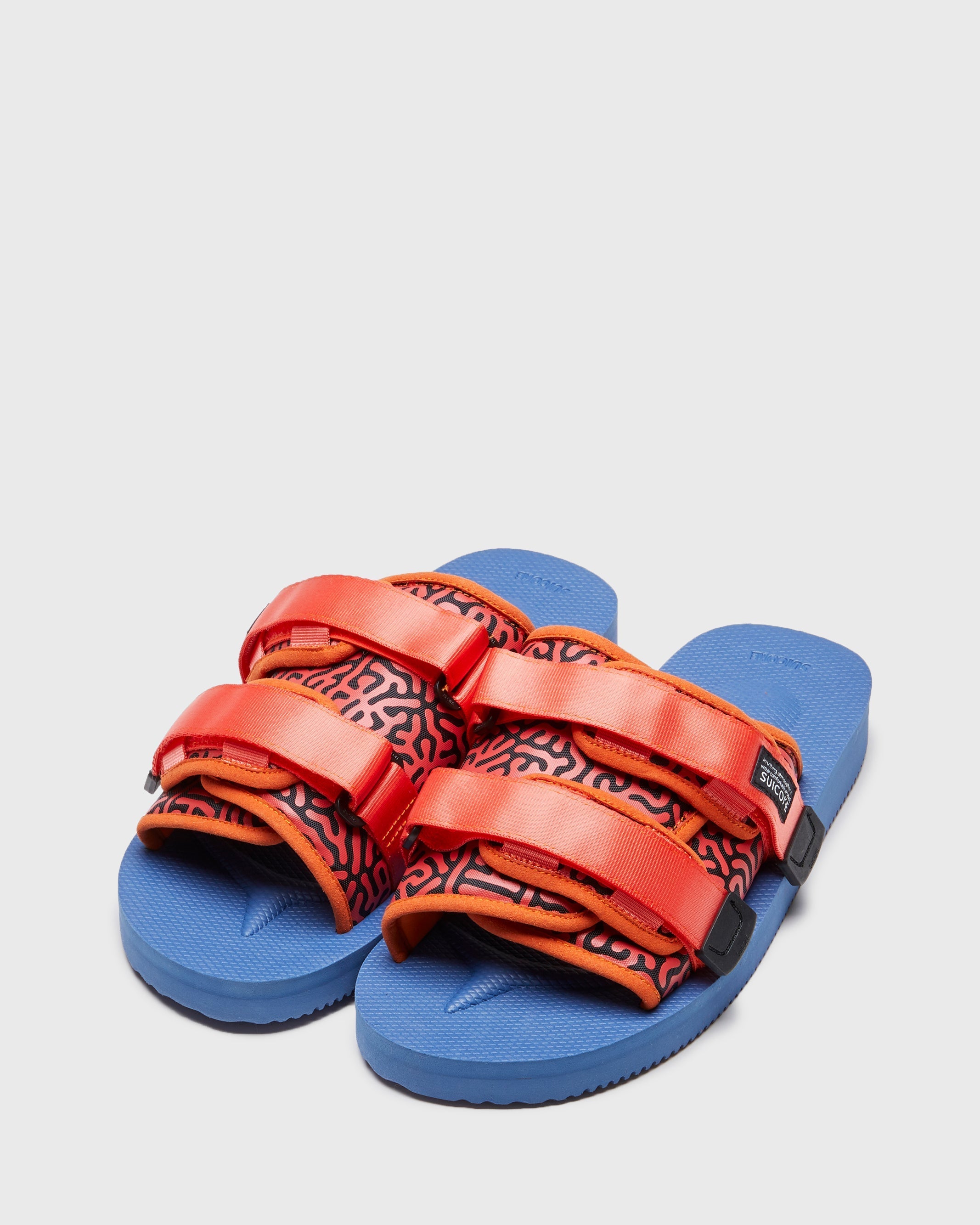 SUICOKE MOTO-Cab-PT06 slides with orange & navy nylon upper, orange & navy midsole and sole, strap and logo patch. From Spring/Summer 2023 collection on SUICOKE Official US & Canada Webstore. OG-056CAB-PT06 ORANGE X NAVY